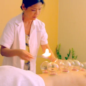 Dr. Liu performing a cupping treatment